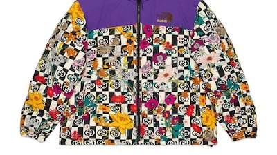 A Nuptse jacket, with flowers and the Gucci logo.