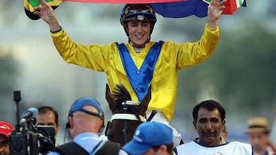 Jockey Christophe Soumillon, riding Mubtaahij, celebrates winning the UAE Derby during the Dubai World Cup at the Meydan Racecourse in Dubai. ( Satish Kumar / The National )