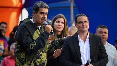 Nicolas Maduro, left, with businessman Alex Saab during a rally in support of the former president in Caracas in 2024. AFP