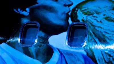 View of an aircraft called “Tango D10S” painted with images depicting Argentine late football star Diego Armando Maradona holding the World Cup, during its presentation in Moron, Buenos Aires province, Argentina, on May 25, 2022. - Some of the 1986 FIFA World Cup champions will travel to the Qatar FIFA World Cup on November, 2022 in the Tango D10S to pay homage to Maradona. (Photo by Tomas CUESTA / AFP)