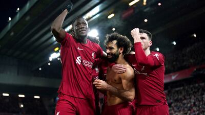 Liverpool's Mohamed Salah, centre, celebrates with teammates after scoring his side's sixth goal against Manchester United at Anfield in Liverpool, England, Sunday, March 5, 2023. PA