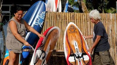 Filipinos clean surfboards outside their closed shop as the government implements the temporary closure of the country's most famous beach resort island of Boracay on Thursday, April 26, 2018. Aaron Favila / AP Photo