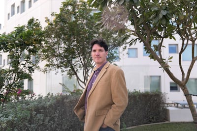 Dr John Burt, an associate professor at NYU Abu Dhabi, studies coral reefs in the Arabian Gulf. Reem Mohammed / The National