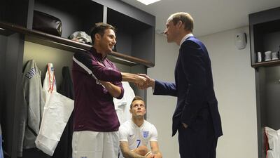 Prince William chats with Frank Lampard and Jack Wilshere following England's international friendly on Friday. Michael Regan / Reuters / May 30, 2014