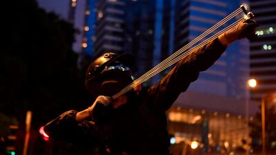 A protester uses a slingshot on Hong Kong's Causeway Bay on August 31, 2019during a 13th straight weekend of demonstrations. AFP