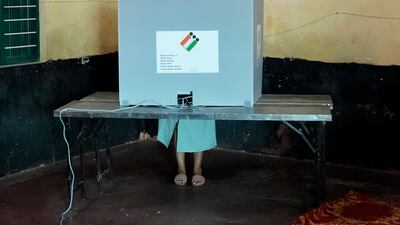 A woman casts her vote at a Karnataka election polling station in Bengaluru, India. AP