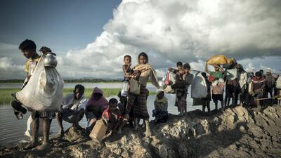 Rohingya refugees crossing from Myanmar into Bangladesh. Since last year, at least 625,000 people, more than half the Rohingya population, have fled to escape persecution AFP