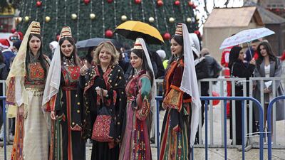 People gather outside the Church of the Nativity. AFP