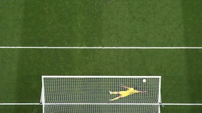 Sevilla's Bono saves a penalty from Roma's Roger Ibanez during the shoot-out. Reuters