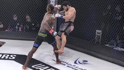 Jaures Dea of Cameroon lands a crushing blow on the Brazilian Andre Pinheiro. Courtesy UAE Warriors