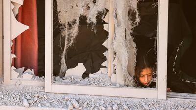 A damaged window at the Palestinian family house in Asker refugee camp. AFP