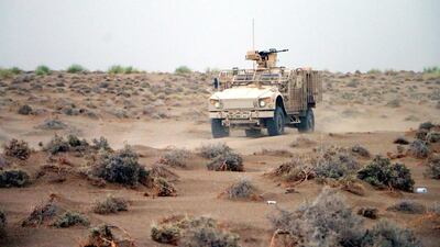 An armoured vehicle takes part in military operations.