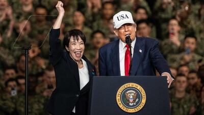 Japan's new Prime Minister Sanae Takaichi and US President Donald Trump on board the USS George Washington aircraft carrier at the US naval base in Yokosuka, central Japan. AFP