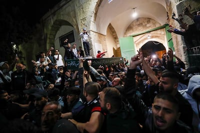 Palestinian mourners carry the coffin of Walid Shareef during his funeral at Al Aqsa Mosque compound in Jerusalem's Old City. EPA
