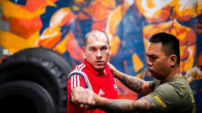 Salem Al Mehairi, who has cerebral palsy, is now a para-karateka. His mother guided him after losing hope that the labour market would welcome people like him. Reem Mohammed / The National