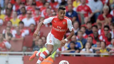 Alexis Sanchez dribbles the ball during Arsenal's win over Benfica in the pre-season Emirates Cup at the Emirates Stadium on Saturday. Andy Rain / EPA / August 2, 2014
