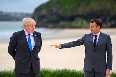Mr Johnson and French President Emmanuel Macron are at odds over Northern Ireland. Bloomberg