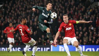 Manchester United's Serbian defender Nemanja Vidic (R) blocks a shot from Real Madrid's Portuguese forward Cristiano Ronaldo during the UEFA Champions League round of 16 second leg match in March. AFP PHOTO / PIERRE-PHILIPPE MARCOU