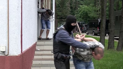 Belarus says the detained Russian men are facing a criminal probe on charges of plotting riots during the country's presidential election campaign. State TV and Radio via AP