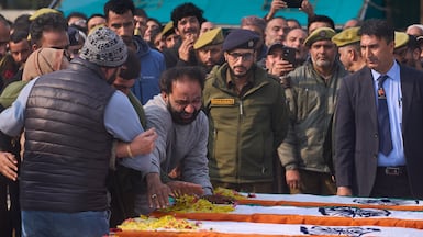 Family members greave near the coffin of their relative during a wreath-laying ceremony for the deceased victims of an explosion inside a police station in Srinagar, Indian controlled Kashmir, Saturday, Nov. 15, 2025. (AP Photo / Dar Yasin)