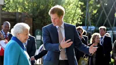 Queen Elizabeth and her grandson Prince Harry attend the 2015 show. Getty Images