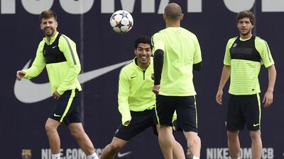 From left to right, Barcelona's Gerard Pique, Luis Suarez, Javier Mascherano and Sergi Roberto train on Monday ahead of Tuesday's Champions League quarter-final second leg against Paris Saint-Germain. Lluis Gene / AFP
