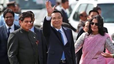 Chinese premier Li Keqiang is received by Indian junior minister for external affairs, E Ahamed, left, after he arrives in New Delhi.