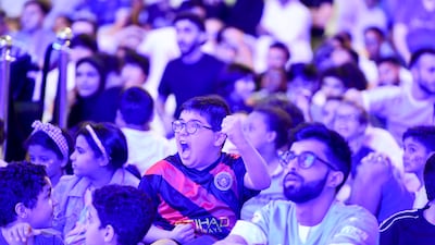 Fans at Yas Mall in Abu Dhabi watch Manchester City beat Inter Milan to win the Champions League final. Khushnum Bhandari / The National
