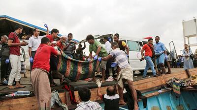 Bodies of Somali refugees who were killed when their boat was attacked off Yemen’s Red Sea coast are unloaded in the rebel-held Yemeni port city of Hodeidah on March 17, 2017. AFP