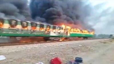 A fire burns a train carriage near the town of Rahim Yar Khan in the south of Punjab province, Pakistan October 31, 2019. Reuters