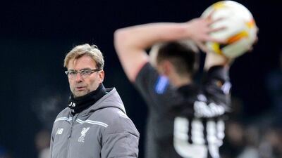 Liverpool's German Coach Jurgen Klopp (L) looks on during the UEFA Europa League group B football match between FC Sion and FC Liverpool at the Tourbillon stadium in Sion on December 10, 2015. / AFP / FABRICE COFFRINI