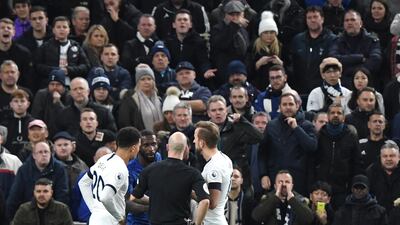 Referee Anthony Taylor speaks to Antonio Rudiger after the Chelsea player was racially abused by Spurs fans. EPA