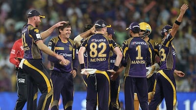 Kolkata Knight Riders cricketer Brad Hogg (2nd L) celebrates the wicket of Delhi Daredevils cricketer Pawan Negi during the 2016 Indian Premier League (IPL) Twenty20 cricket match between Kolkata Knight Riders and Delhi Daredevils at the Eden Gardens Cricket Stadium in Kolkata on April 10, 2016. AFP / Dibyangshu SARKAR