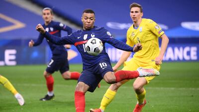 Kylian Mbappe lines-up a shot against Ukraine. AFP