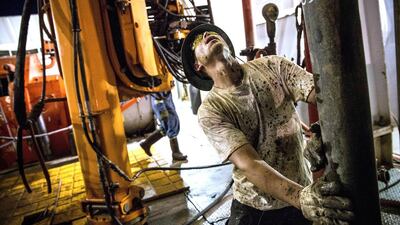 A floor hand for Raven Drilling in the US Bakken shale formation, where total break-even price is up to US67 per barrel. Andrew Burton / AFP