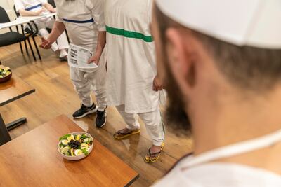 Inmates at Dubai Central Jail present one of their dishes. Antonie Robertson / The National
