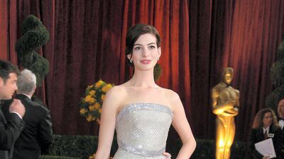 2009: Anne Hathaway arrives at the 81st Academy Awards in a strapless Armani gown. AFP