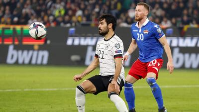 Germany midfielder Ilkay Gundogan and Liechtenstein's defender Sandro Wolfinger vie for the ball. AFP