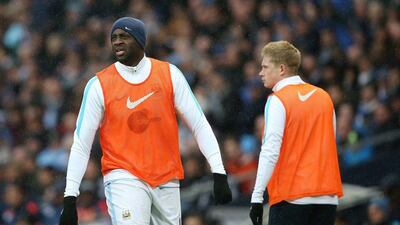 Yaya Toure (L) and Kevin de Bruyne of Manchester City warm up during the Premier League match between Manchester City and West Bromwich Albion at the Etihad Stadium on April 9, 2016 in Manchester, England. (Photo by Jan Kruger/Getty Images)