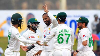 Pakistan bowler Nauman Ali celebrates with teammates after taking the wicket of Sri Lanka captain Dimuth Karunaratne for 61. AFP