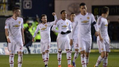 Manchester United's Juan Mata celebrates scoring against Shrewsbury Town on Monday night in the FA Cup. Oli Scarff / AFP / February 22, 2016