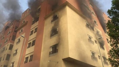 Smoke billows from a fire at a residential complex used by state oil giant Saudi Aramco in Khobar. Saudi Interior Ministry General Directorate of Civil Defense via AP
