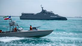 An IRGC warship and speed boat taking part in a parade in the Arabian Gulf in 2024. AFP