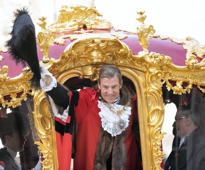 William Russell, the 692nd Lord Mayor of the City of London, waves from the State Coach during the Lord Mayor's Show in the City of London. Getty Images