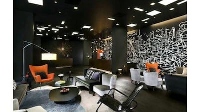 The chic black lobby at the upmarket and centrally located Thompson Toronto hotel.