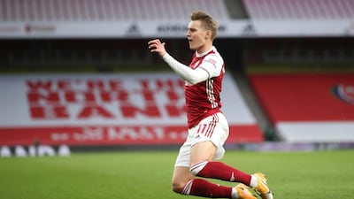 Arsenal's Martin Odegaard celebrates after scoring his side's opening goal. AP