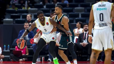Dwayne Bacon, left, of Dubai Basketball in action.