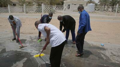 Five men were fined, had their cars sold at auction and were made to sweep the streets as punishment for reckless driving. Courtesy: Abu Dhabi Judicial Department