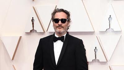 Joaquin Phoenix, wearing Stella McCartney, arrives at the Oscars on Sunday, February 9, 2020, at the Dolby Theatre in Los Angeles. AP
