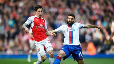 Hector Bellerin of Arsenal is tackled by Mile Jedinak of Crystal Palace during the Premier League match between Arsenal and Crystal Palace at the Emirates Stadium on April 17, 2016 in London, England. (Photo by Mike Hewitt/Getty Images)